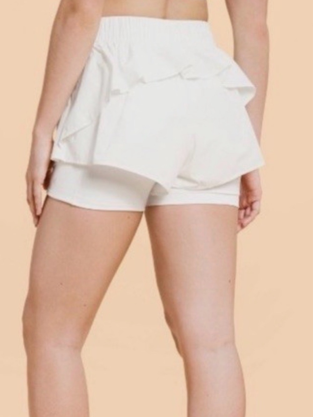 Blogilates Ruffle Short in color Sugar Swizzle